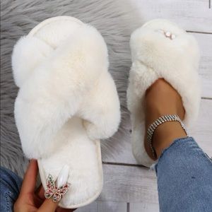 All white soft furry slippers